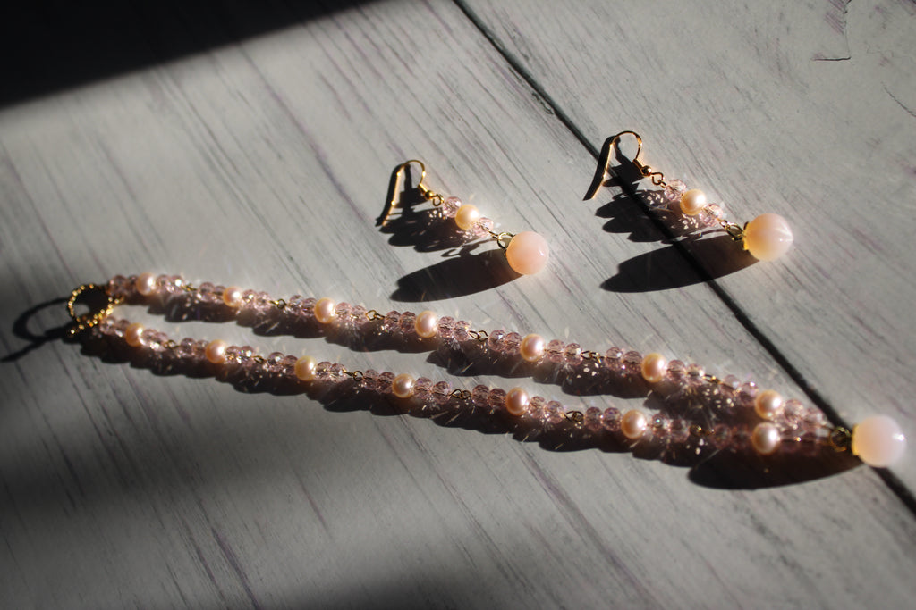 necklace and earring set featuring glass peach charms