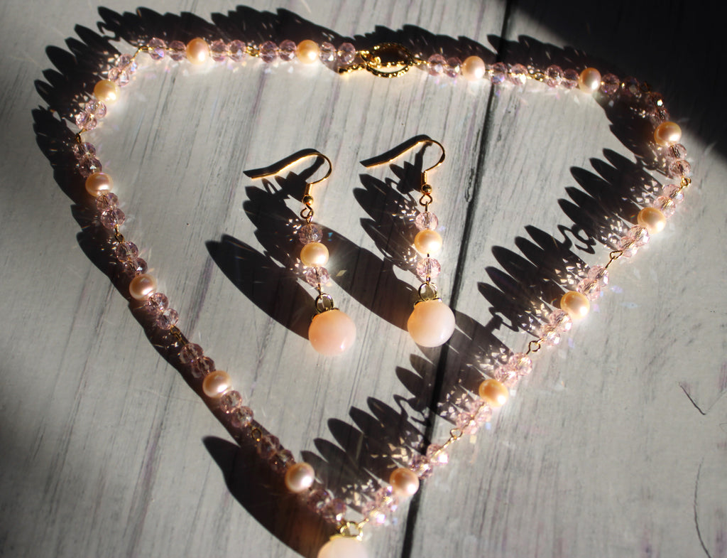 necklace and earring set featuring glass peach charms and freshwater pearls