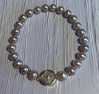 lavender freshwater pearls AAA grade with mother of pearl and gold clasp
