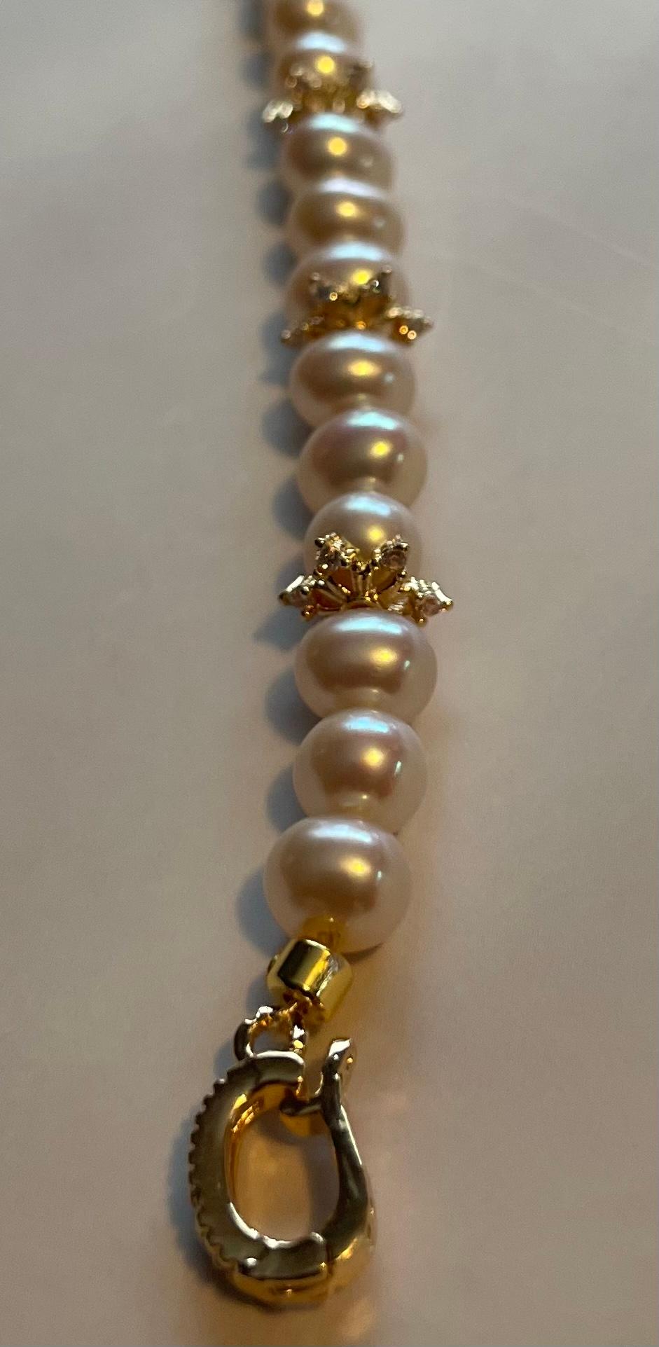 AAA grade freshwater pearl bracelet with 14k gold snowflake accents