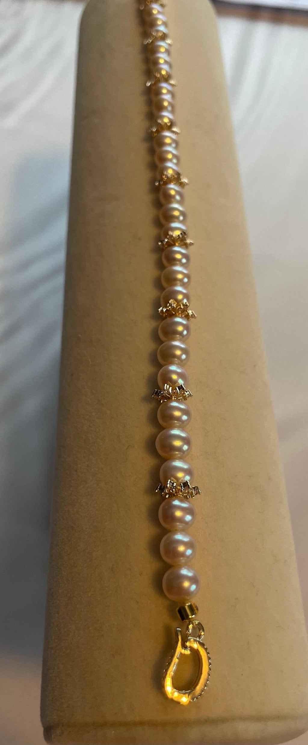 AAA grade freshwater pearl bracelet with 14k gold snowflake accents