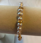 AAA grade freshwater pearl bracelet with 14k gold snowflake accents