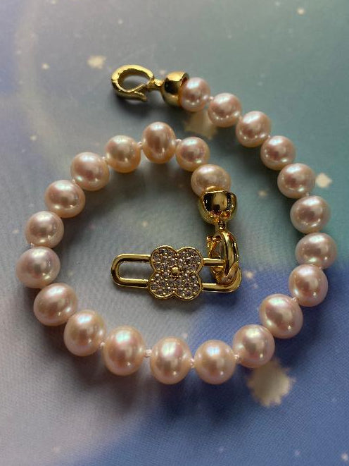 AAA grade white freshwater pearl braclelet with gold flower lock clasp
