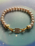 AAA grade white freshwater pearl bracelet with gold flower clasp