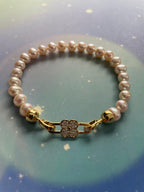 AAA grade white freshwater pearl bracelet with gold flower clasp
